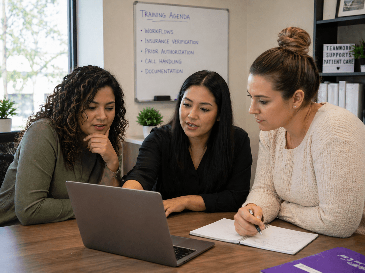 Medical virtual assistant training session — staff focused on laptop showing healthcare workflow checklist